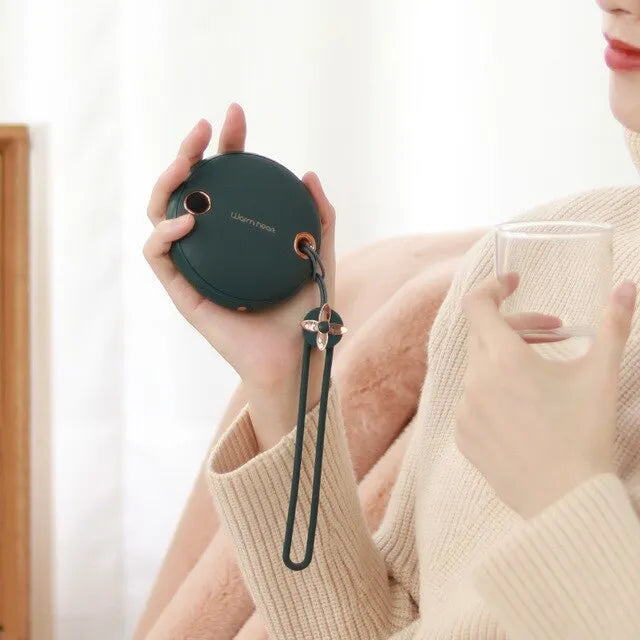 Green, pink or white 5000mAh power bank with digital display and integrated hand warmer function.