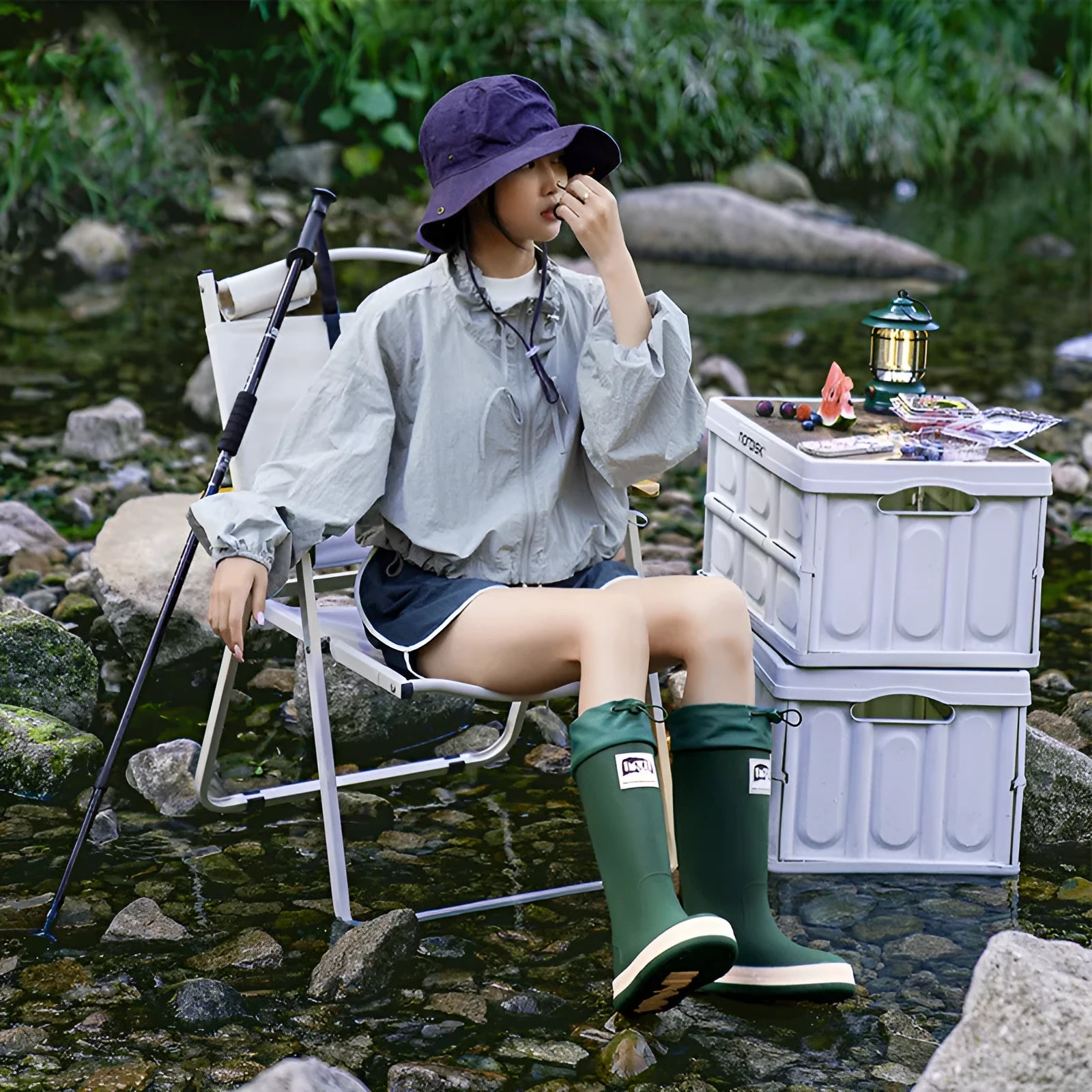 Pair of solid colour high tube PVC rain boots with a low heel on a non-slip sole.