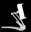 Silver aluminium alloy desktop tablet stand with adjustable holder and white mounting base on a wooden table.