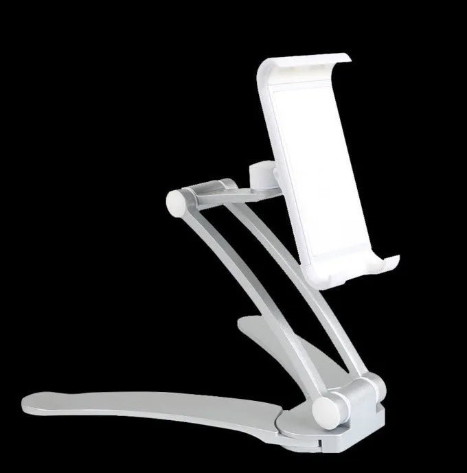 Silver aluminium alloy desktop tablet stand with adjustable holder and white mounting base on a wooden table.