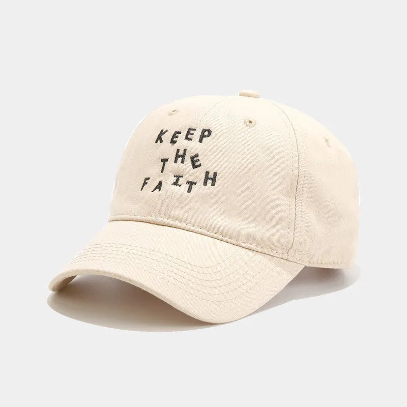 Men's beige cotton baseball cap with adjustable strap and dome crown on a white background.