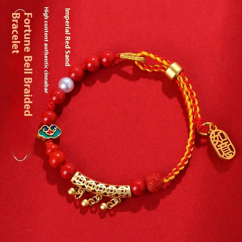 Women's hand-woven cinnabar rope bracelet with round bell charm in emperor red sand colour