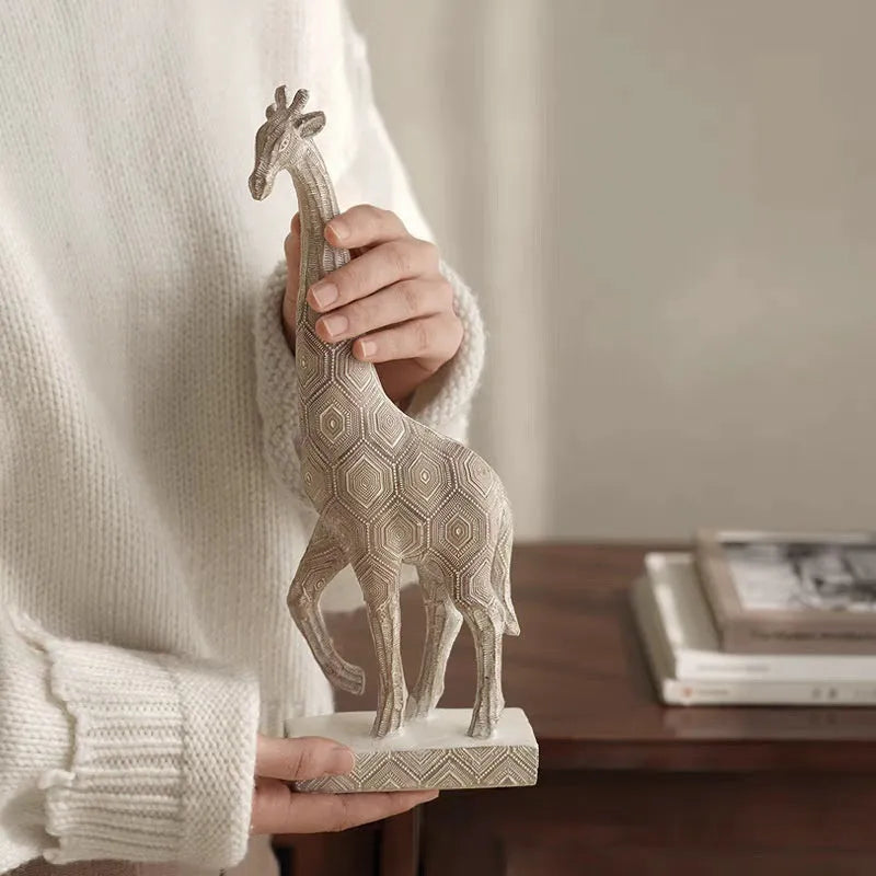 Wood colour giraffe resin ornament on a table, showing European style design and 30.5cm height.