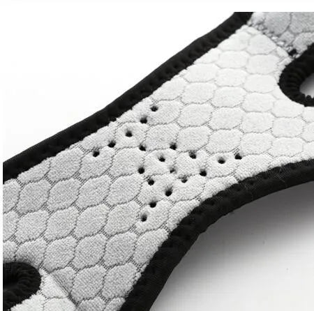 Professional patella band knee support in black with shock absorbing EVA pad and breathable rear perforations