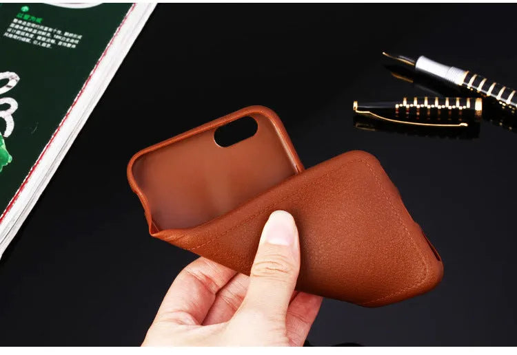 Genuine leather iPhone case with TPU bumper in Black, Brown, Navy Blue, and Wine Red colours for multiple models.