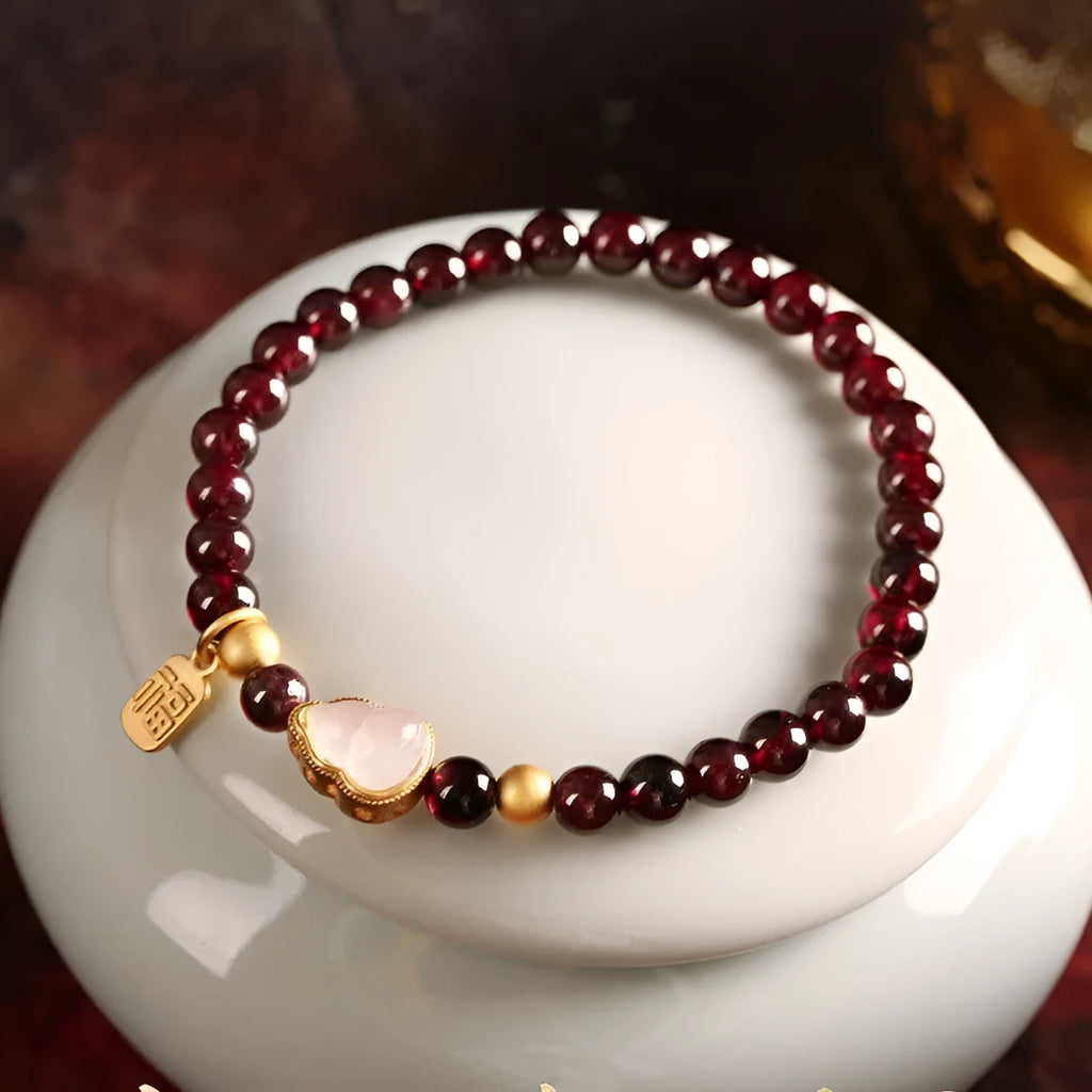 Chinese style gourd bracelet with imitation garnet stones and cultural motifs including Fu character design