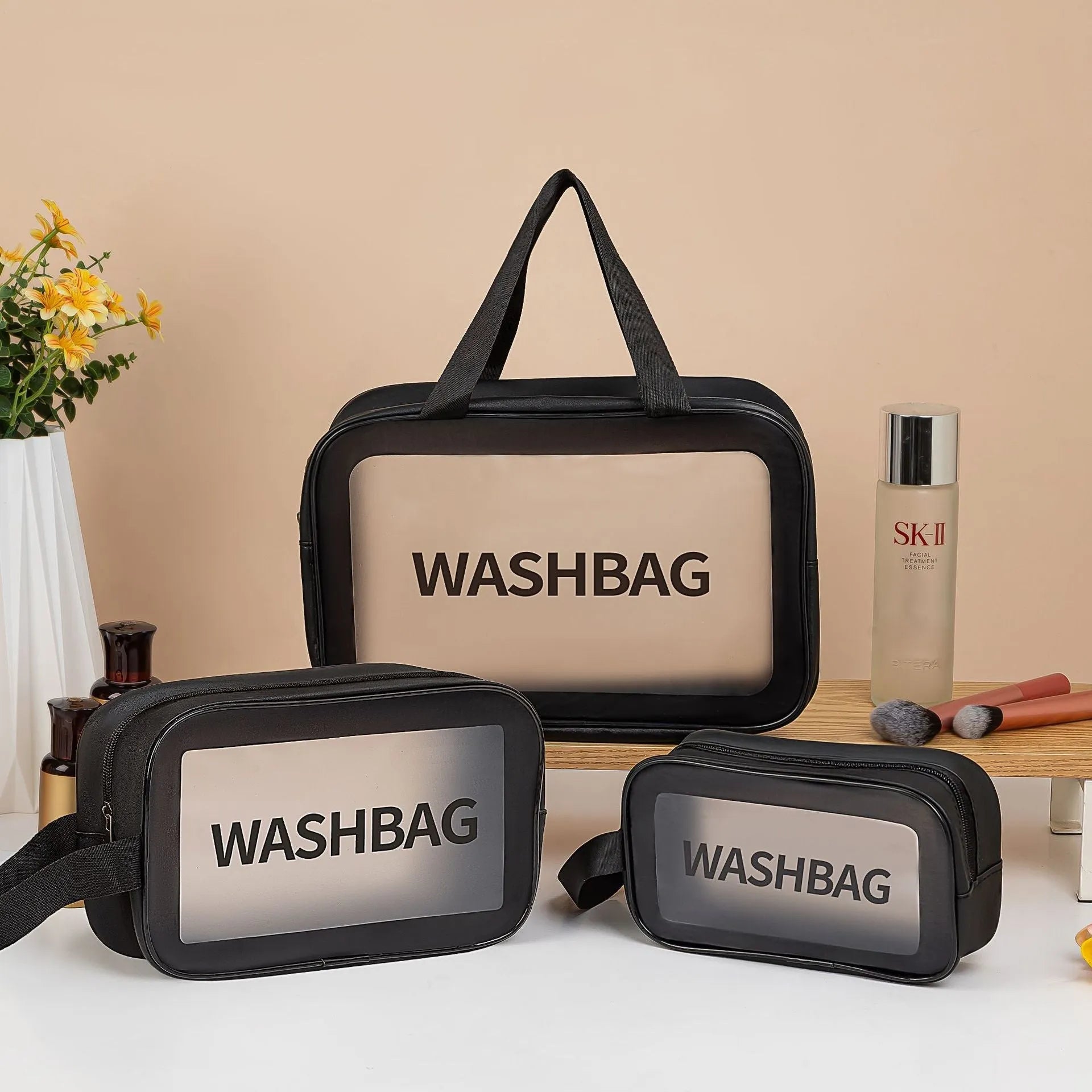 Large PVC transparent cosmetic bag three-piece set in various colours including beige, black, blue, pink, and white, empty and open on a flat surface