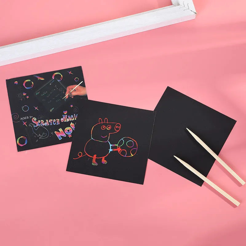Colourful trumpet scratch art kit for children showing the design on the paper and the full presentation box.