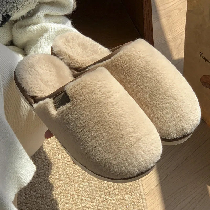 Solid colour winter plush slippers with non-slip PVC soles on a wooden floor