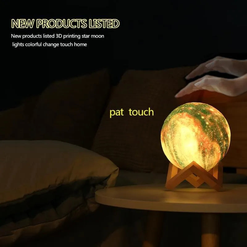 3D-printed sphere lunar night light on a base with a remote control.