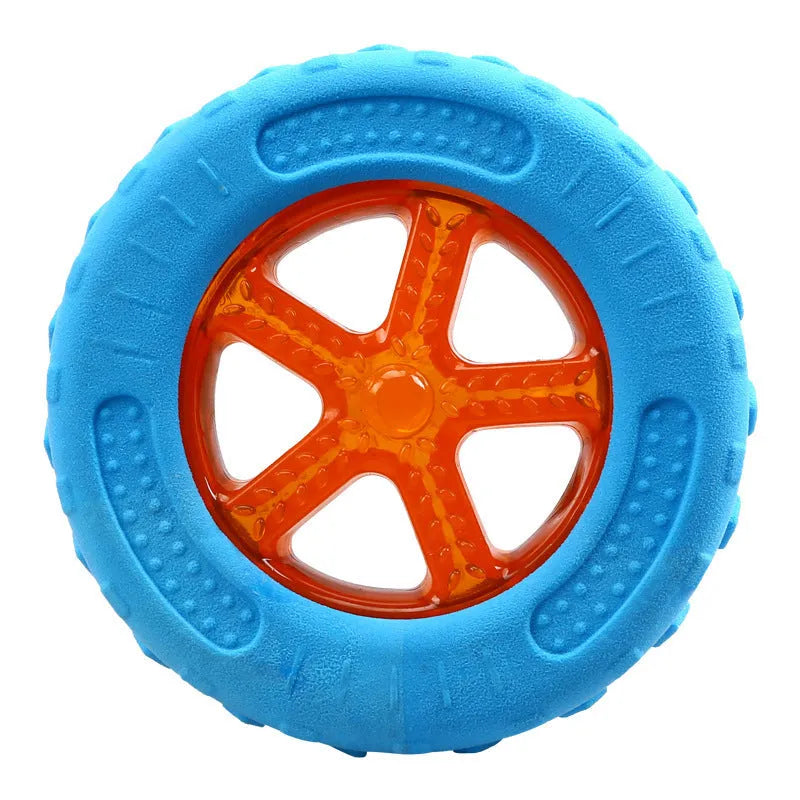 Three floating TPR dog toys: a squeaky ball, barbell, and tyres for water and land play.