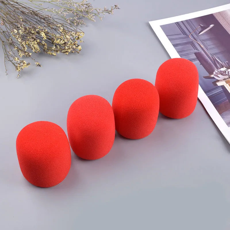 Four multicoloured foam microphone windshields for ball-shaped handheld stage microphones
