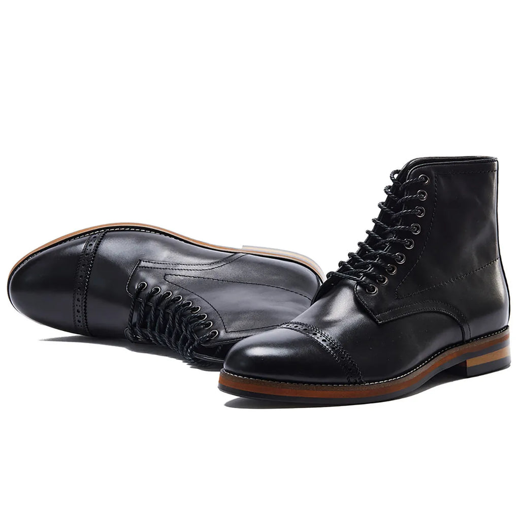 Brown mid-top Martin boots for men with leather upper, lace-up fastening, and rubber sole