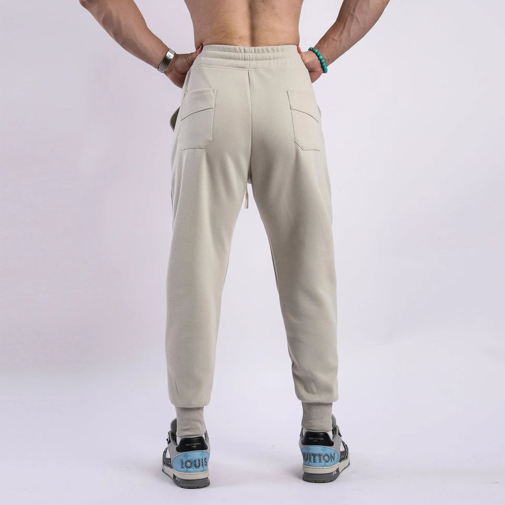 Men's ankle-tied drawstring sweatpants in polyester cotton, available in five colours and sizes M to XXXL