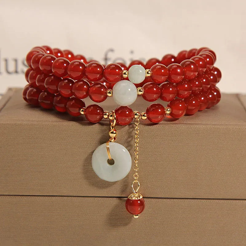 Red agate multi-layer bracelet with adjustable closure showing natural stone texture