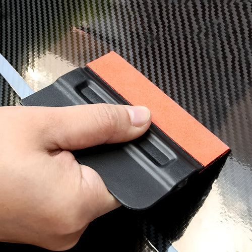 Car vinyl wrap scraper tool with black ABS plastic handle and interchangeable blue deerskin scraping pad.