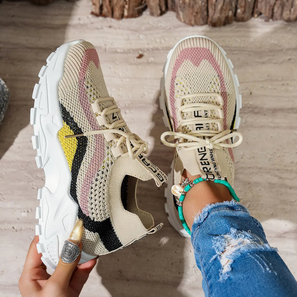Women's soft bottom lace-up sports shoes in mesh with PVC sole.
