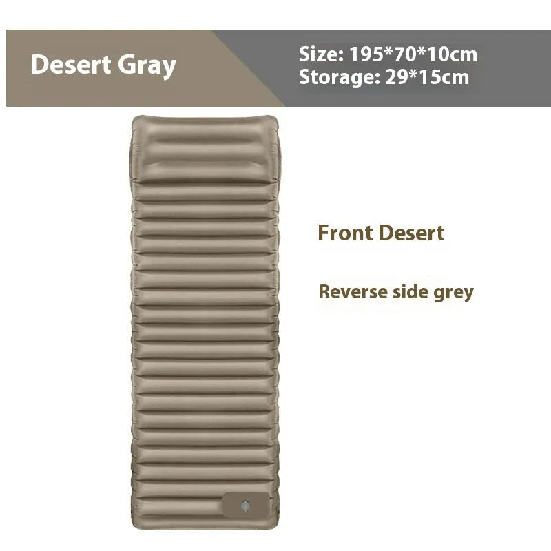 Single-size portable inflatable camping mattress in grey on a tent floor