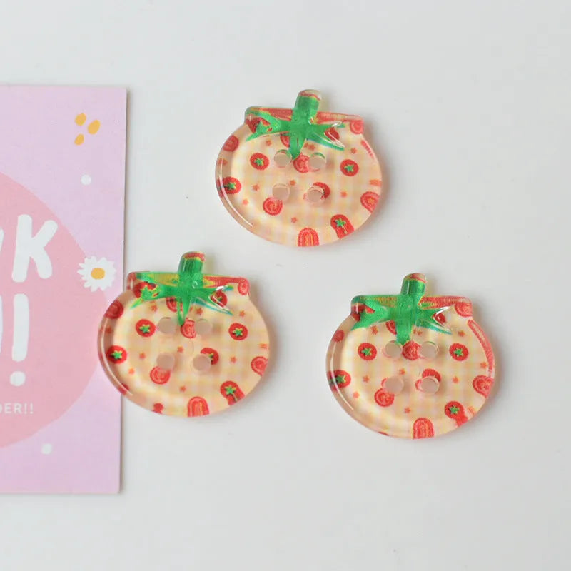 Plastic tomato button ornaments in cherry tomato printing, red plaid, solid red, and mixed colour designs