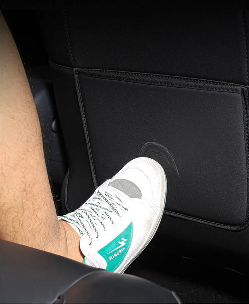 Two black leather rear anti kick pads for car seats, showing size and single pocket.