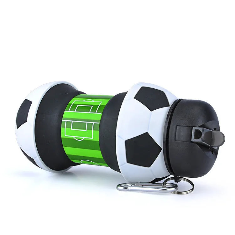 White collapsible soccer ball silicone water bottle with straw and black carrying clip on white background