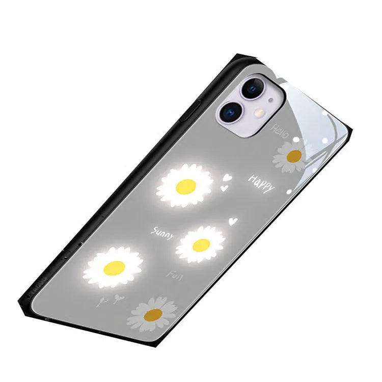 White luminous iPhone case with painted purple daisy design and voice-activated colour light.