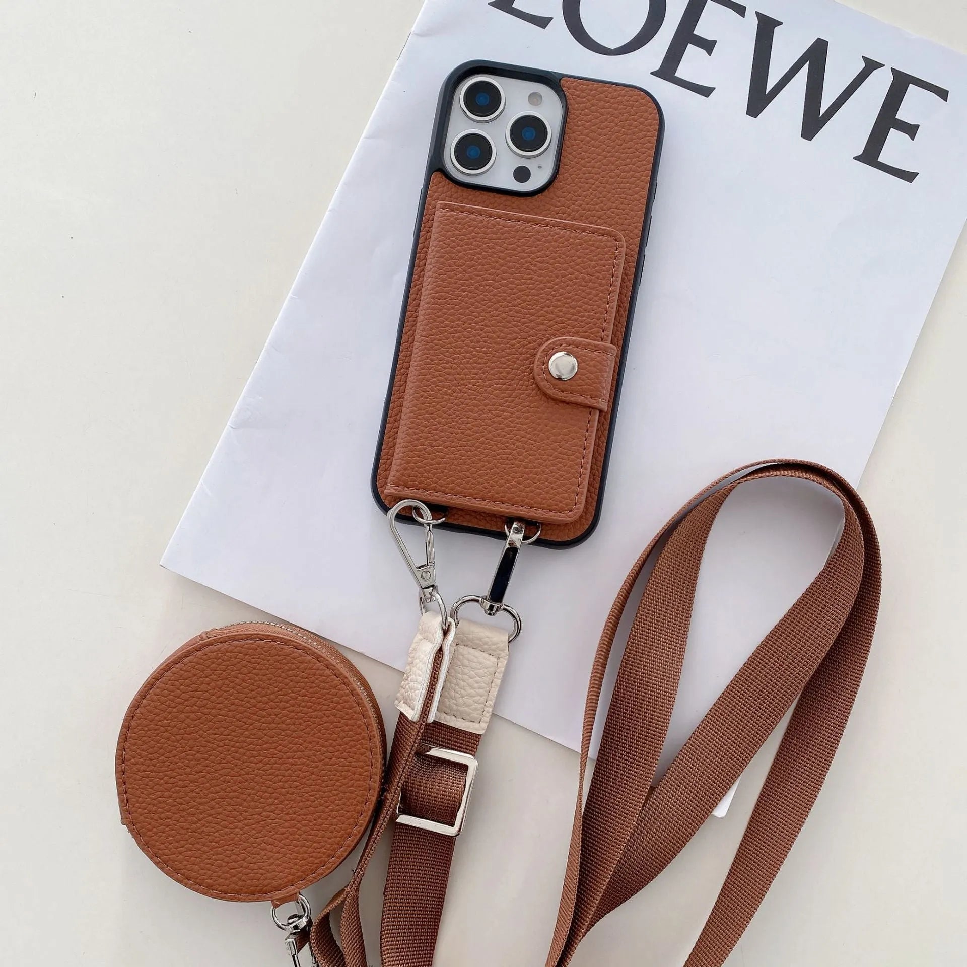 Black PC leather iPhone case with a card slot on the back and a lanyard hole at the corner.