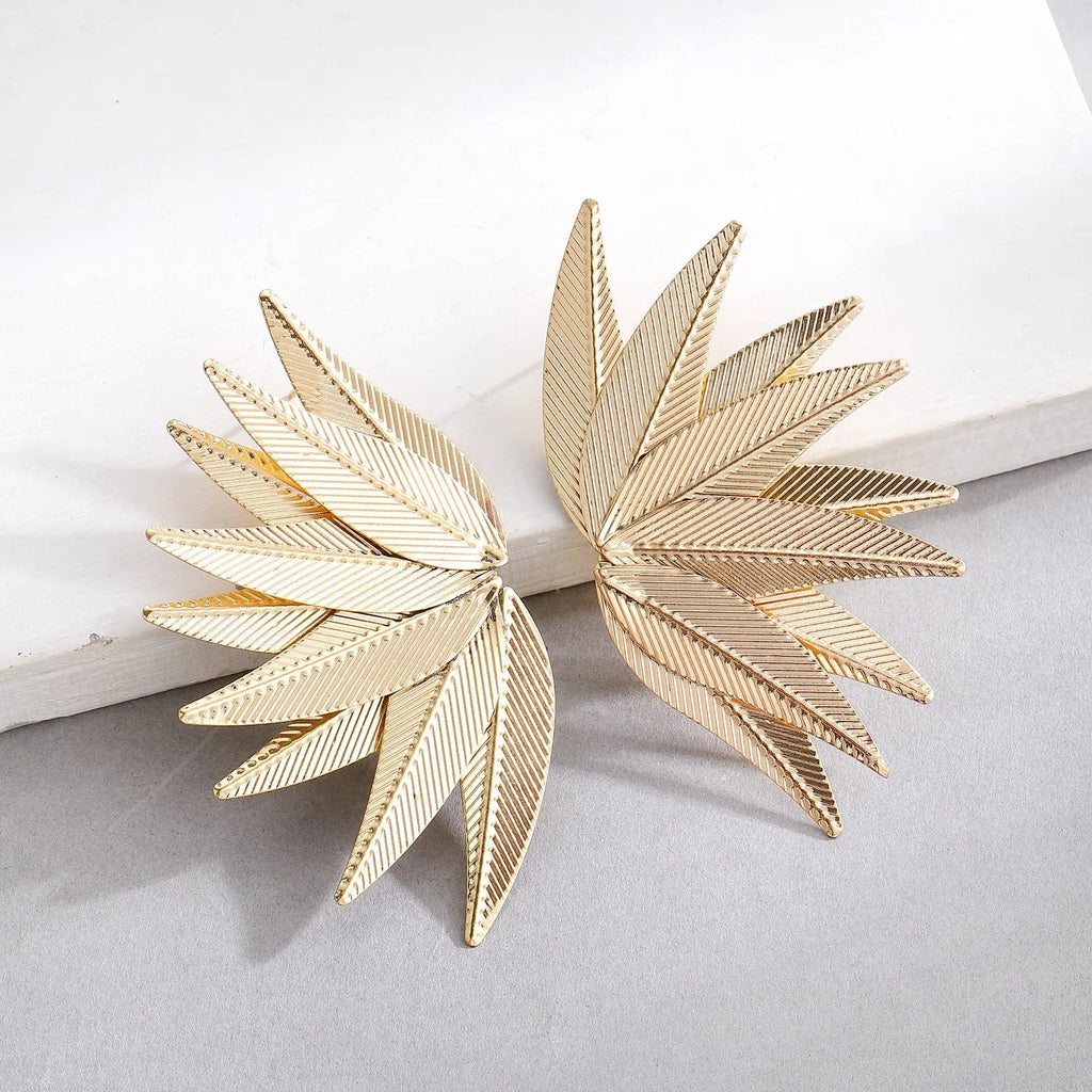 Leaves patch earrings in gold and white colour options with geometric leaf silhouette design