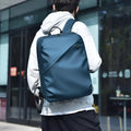 Men's waterproof backpack in black, blue or grey colour with PU leather construction and sewing thread detailing