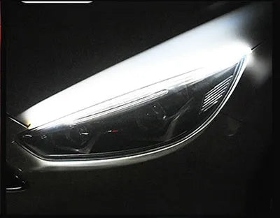 Flexible silicone car LED strip for daytime running lights and animated turn signals on a vehicle headlight.
