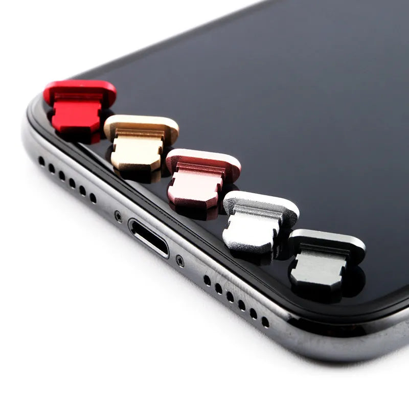 Aluminium alloy charging port dust plug for iPhone in various colours including gold, black, and rose gold.