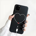 Frosted TPU iPhone case showing painted 'LOVE' letter design on a pink background.