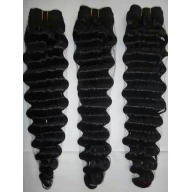 Real hair wig with natural curls in medium long length shown on a mannequin head