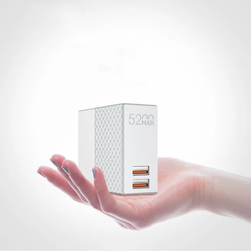 White two-in-one power bank charger with folding plug, showing compact cylindrical design.