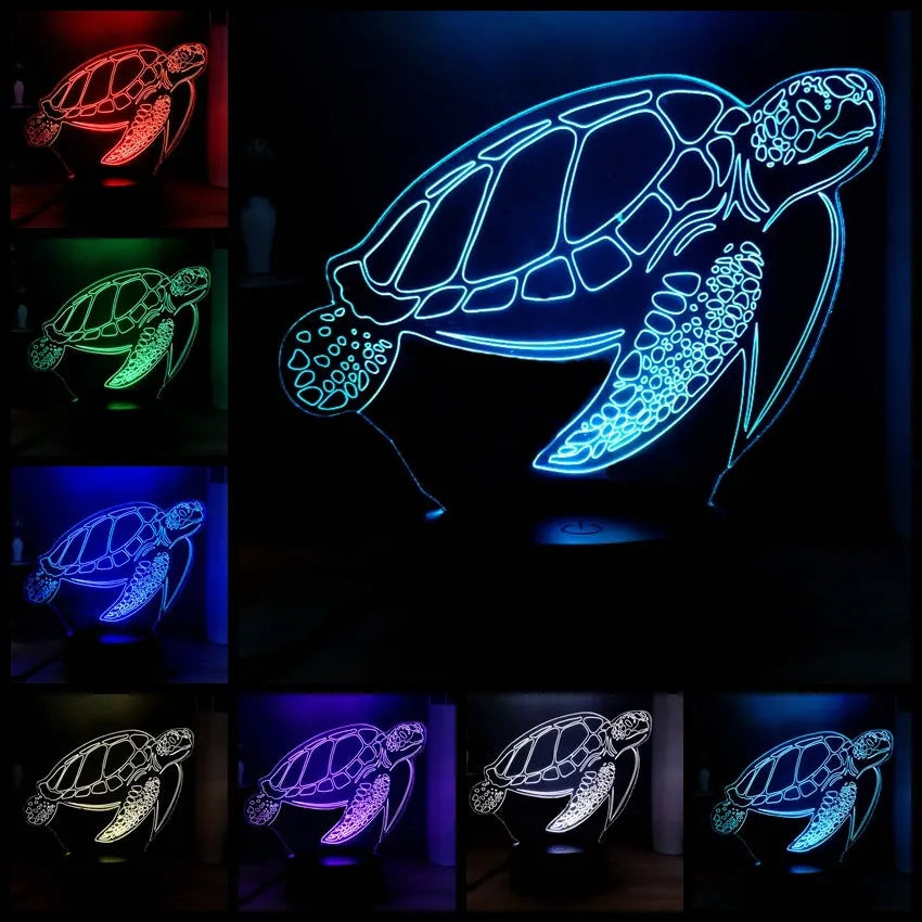 3D acrylic turtle-shaped LED night light with colour-changing illumination on a surface.