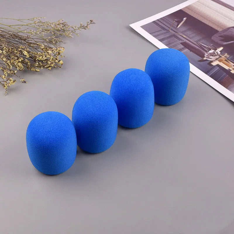 Four multicoloured foam microphone windshields for ball-shaped handheld stage microphones