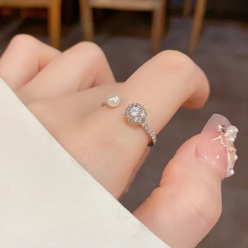 Round zircon open-end pearl ring in gold or silver colour with thick real gold plating over copper