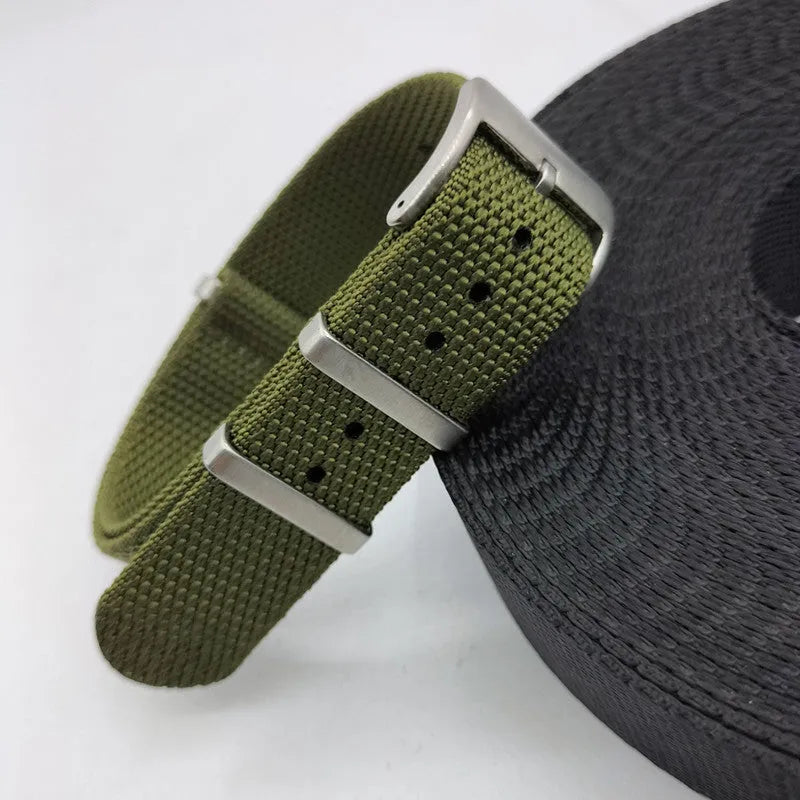 Nylon integrated watch strap in Army Green colour, shown next to Black, Deep Khaki, Light Gray, and Sapphire Blue options.