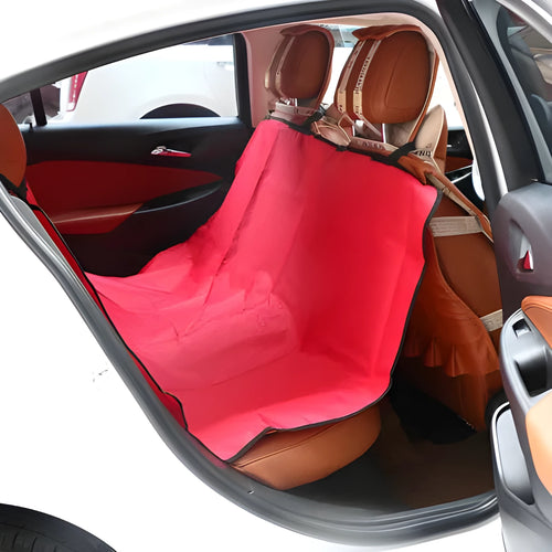 A square black car pet pad for dogs and cats on a vehicle seat.