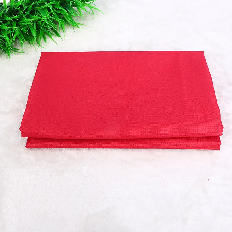A square black car pet pad for dogs and cats on a vehicle seat.