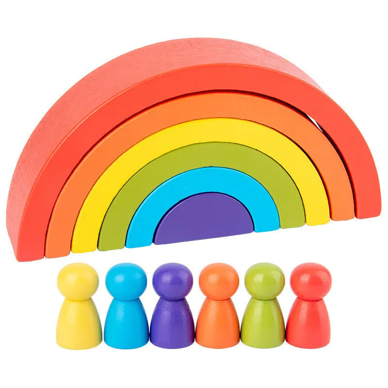 Rainbow arched wooden building blocks in a colourful stack on a flat surface
