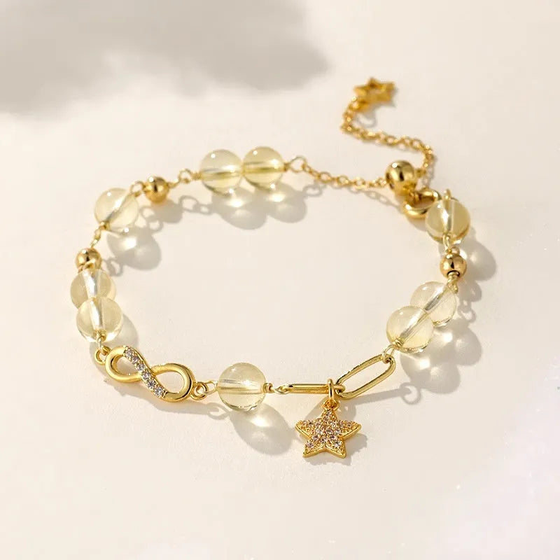 A women's adjustable Mobius crystal bracelet with a constellation design, showing the gray moonstone colour option.