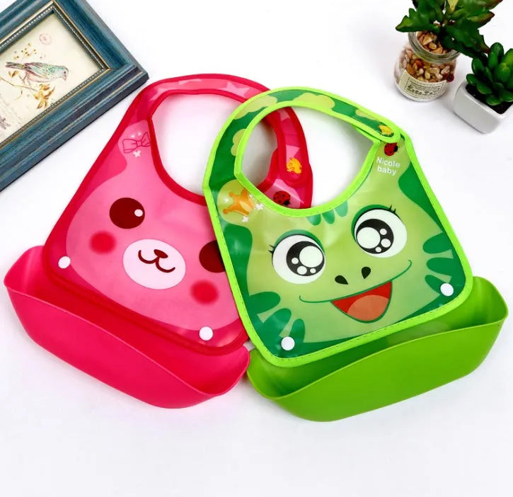 Cartoon baby PVC three-dimensional bib with blue koala pattern, silicone pocket and cotton cloth section on white background