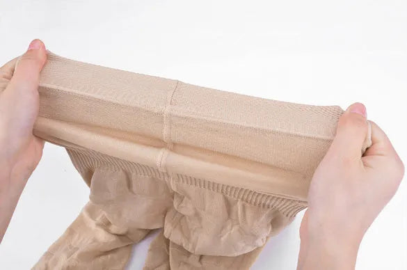 Black seamless high waist shapewear shorts for women on a mannequin, showing tummy control design.