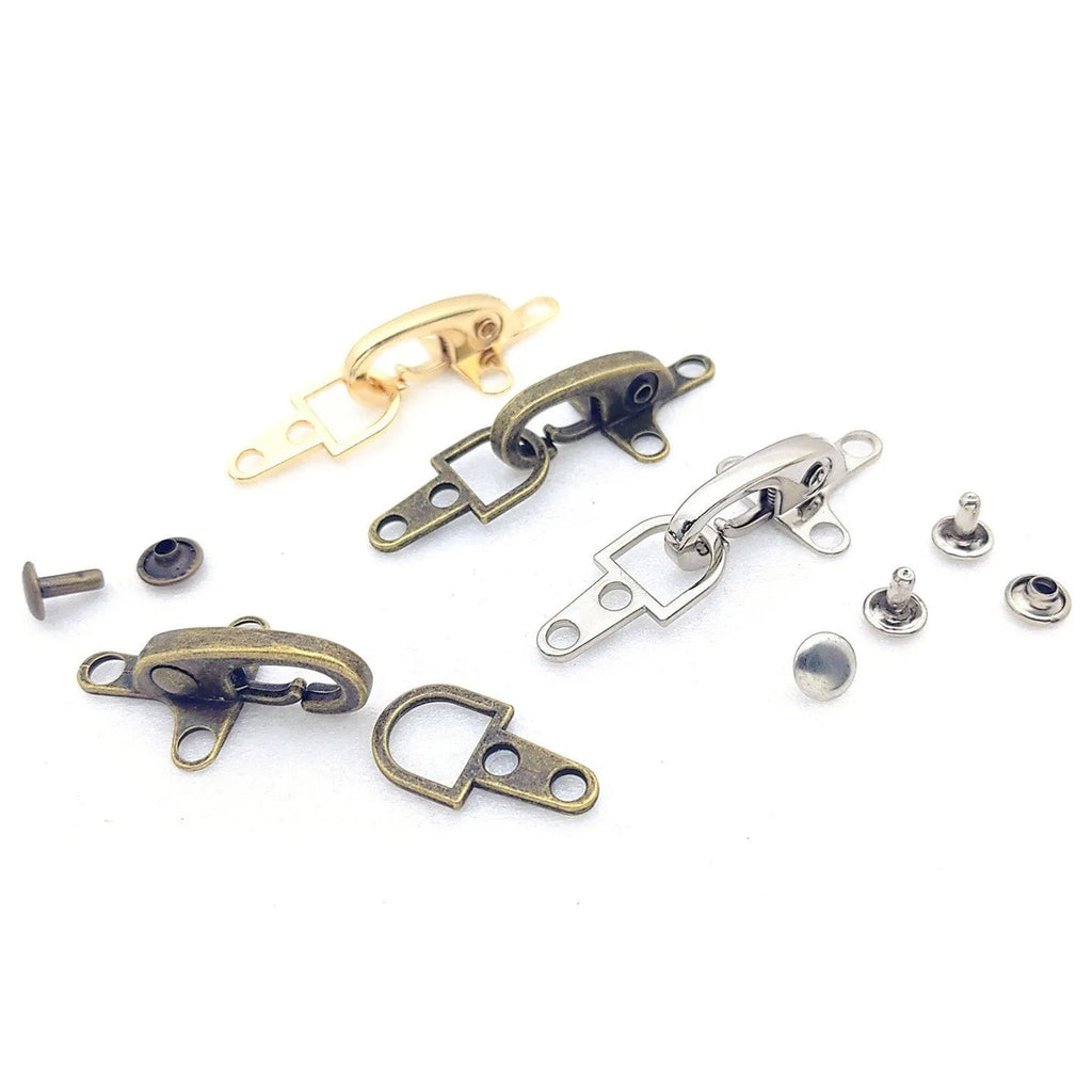 Alloy metal aircraft buckle decoration measuring 5.85cm in bronze, gold, gun colour, and silver finishes