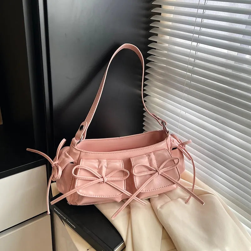Women's shoulder bag with tassel bow decoration and pleated multi-pocket design in various colour options