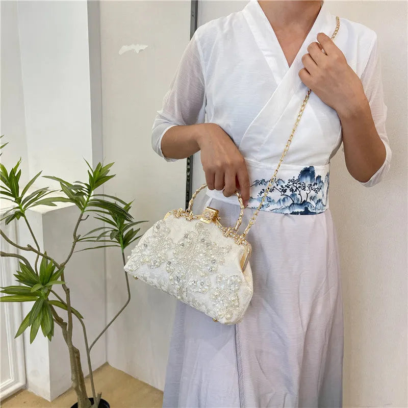Pearl embroidered soft polyester handbag with double shoulder straps in floating light-white colour