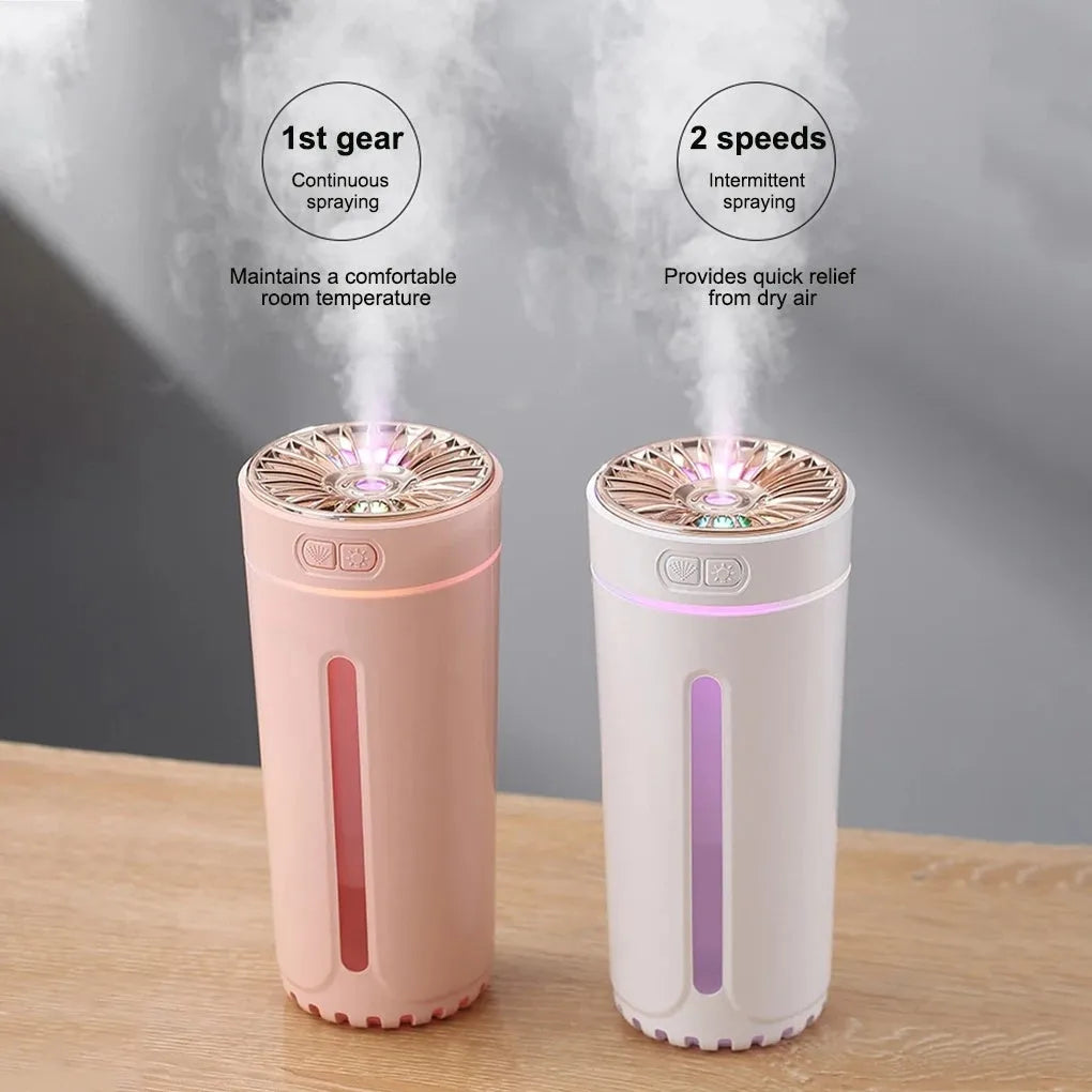 Portable black USB humidifier with colourful lights on car cup holder