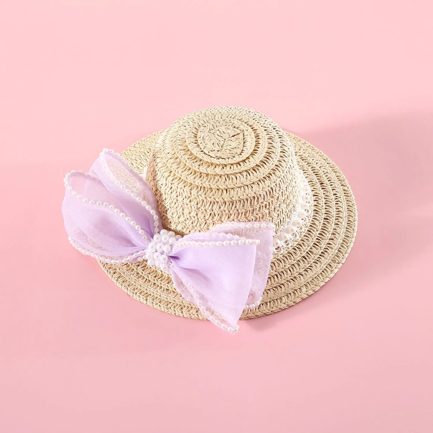 Woven straw cat hat with a pearl bow, shown in blue, pink, purple, and white colour options