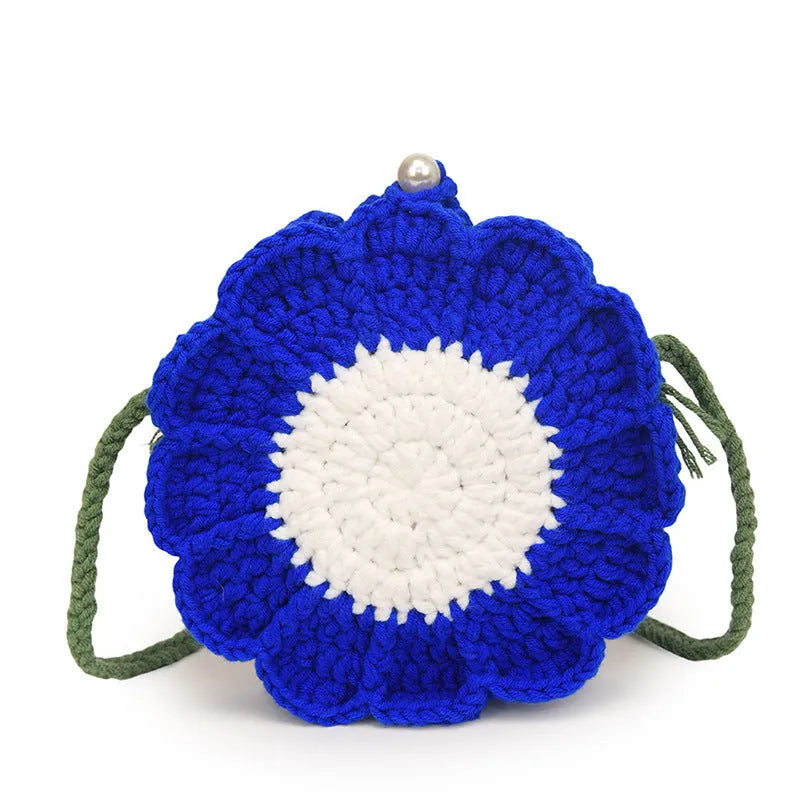 Hand-woven bag with crocheted wool flowers and mobile phone compartment in round suitcase shape